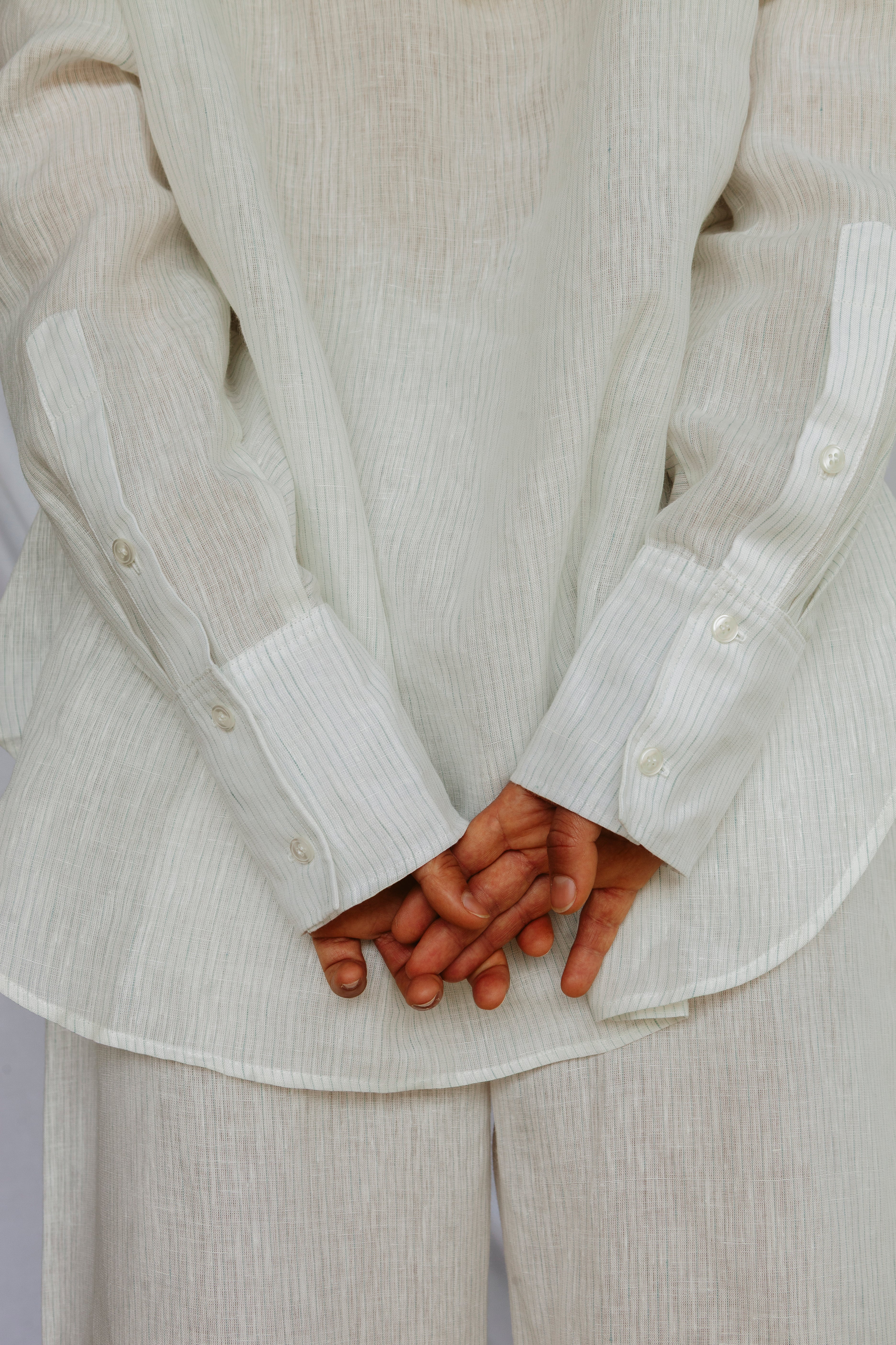 Oversized white and blue-green striped linen shirt with wide-leg trousers by MARAH